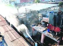 Firemen try to douse flames at a unit in Industrial Area, Phase 2, Panchkula, on Monday. 