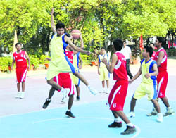 Players in action in a match in the AC BEG Inter-school Basketball Tournament in Dehradun
