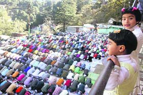 Muslims offer prayers during the Eid-ul-Azha festival in Shimla on Monday