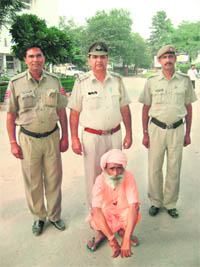 The accused sadhu in police custody in Rewari.