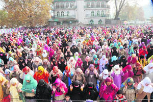 Kashmiri Muslim women pray during Eid-ul-Azha at the TRC ground in Srinagar on Monday.