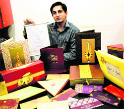 Himanshu displays designer wedding cards