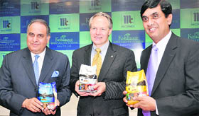 Kohinoor Foods MD Gurnam Arora (L), McCormicks Chairman Alan D. Wilson (C) and MD of new joint venture, Satish Rao at the launch of new products in New Delhi on Tuesday.