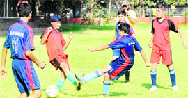 Players in action during a match of the Kanwar Harbans Lal Memorial Football Tournament in Chandigarh on Tuesday.