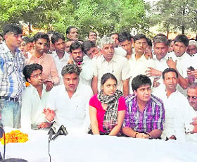 Congress candidate from Adampur Kulbir Beniwal addresses a meeting in Hisar district on Tuesday. 