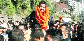 Vikramaditya, son of Union Minister Virbhadra Singh, celebrates his victory in the state Youth Congress poll with his supporters in Shimla on Tuesday.