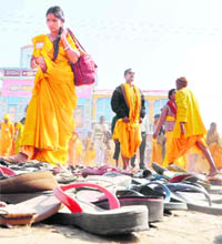 Footwear left in a field after a stampede during Gayatri Mahakumbh, a religious ceremony, in Haridwar on Tuesday. 