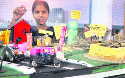 A student explains the concept of her model on display at a tehsil-level science competition in Ludhiana
