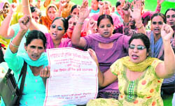 Anganwari workers hold a protest in support of their demands in Patiala