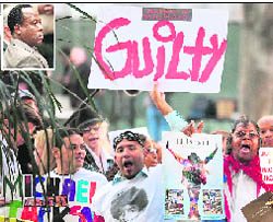 Supporters of Michael Jackson hold placards outside the courthouse in Los Angeles on Monday; and (left) Michael Jacksons doctor Conrad Murray.