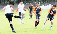 Players in action during the ongoing sixth Kanwar Harbans Lal Memorial Football Tournament at Football Stadium, Sector 17, Chandigarh. 