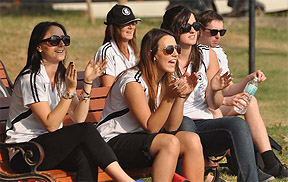 Students of Deakin University from Australia watch a cricket match between the teams of the university and the Ansal Institute of Technology in Gurgaon
