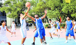 Players vie to take control of the ball in a match at the AC Deb Memorial Invitational 