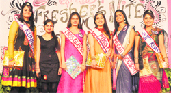 Winners strike a pose with their titles during a freshers day celebrations at the Guru Nanak Institute of Fashion designing and Technology in Ludhiana on Wednesday.