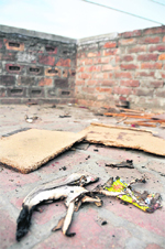 The victims half-burnt shirt lying on the top of the house at the New Kundan Puri area in Ludhiana on Wednesday. 