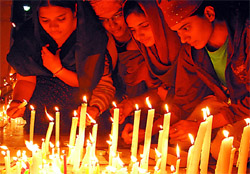 Devotees light candles on the occasion of the birth anniversary of Guru Nanak Dev, at Gurdwara Qila Mubarak in Bathinda on Thursday evening