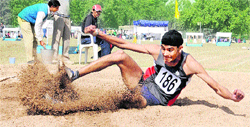 A participant in action during the long jump event of the ongoing Panjab University Annual Athletics Meet in Chandigarh on Thursday.