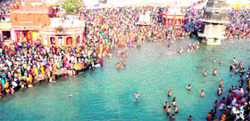 A view of the Har-ki-Pauri area as devotees take a dip in the holy Ganga in Haridwar on Thursday.