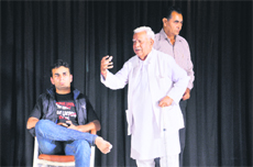 Sessions Judge KK Doda (retd) enacts a scene from the play, Shraddha, at Atam Auditorium in Panchkula.