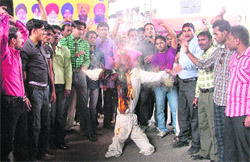 Shiv Sena activists burn an effigy of the UPA government to protest against the rising prices of essential commodities in Ludhiana on Thursday