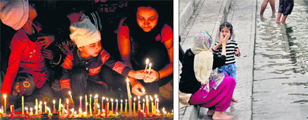Devotees light candles at a gurdwara on the occasion of Gurpurb in Ludhiana on Thursday; and (right) a woman sprinkles sarovar water on her daughters face