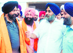 Deputy CM Sukhbir Badal with Harmit Singh Kalkaji (L) in New Delhi