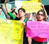 Junior resident doctors of Guru Nanak Dev Hospital shout slogans against the government in Amritsar on Friday.