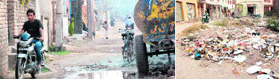 A motorcyclist makes his way through a potholed road in Ward No. 5 of Zirakpur. (right) Garbage lying scattered along a road.