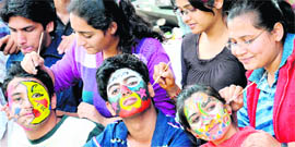 Students get their faces painted during Pecfest 2011 in Chandigarh on Friday.