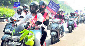 Students take part in a womens two-wheeler safety helmet rally organised by the Chandigarh Police in Sector 17 on Friday.