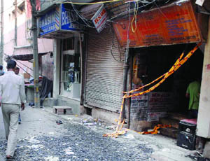 A view of the gutted jewellery shop at Karol Bagh in New Delhi on Friday.