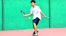 A player in action in a match in the 13th Uttarakhand State Open Junior Tennis Tournament in Dehradun on Friday.