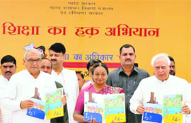 Lok Sabha Speaker Meira Kumar (centre) with Union Human Resources Development Minister Kapil Sibal and Chief Minister Bhupinder Singh Hooda at the launch of a nationwide campaign on right to education at Nuh in Mewat district on Friday