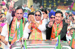 BJP candidate Gurnam Kaur (centre) with party president Khimi Ram (right) and Horticulture Minister Narender Bragta at Nalagarh after filing her nomination on Friday. 
