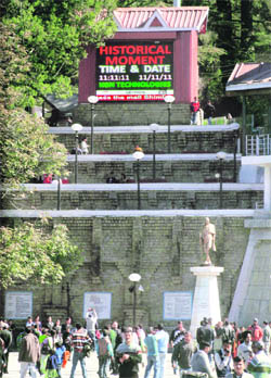 A digital screen shows an interesting combination of date and time 11-11-11 at the Ridge in Shimla on Friday. 