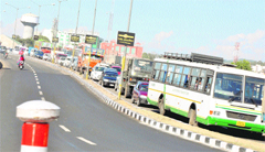 A traffic jam on the flyover caused by the students protest outside the main gate of University of Jammu on Friday. 