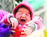 A newborn in the maternity ward of a hospital in Srinagar on Friday.
