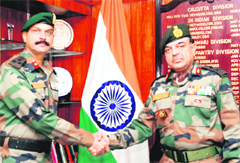 Maj-Gen Surinder Singh (right) being welcomed by the Deputy GOC of Tiger Division, Brig Pankaj Saxena, at the division headquarters in Satwari Cantonment on Friday