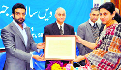 Dr Sharmila Pimple receives the Fr Tong Memorial Award - 2011 from Minister for Sheep and Animal Husbandry Aga Syed Rohulla at a function in Srinagar