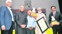 Dr Ibrahim G Thomas and A Balakrishanan (extreme right) with their awards in Ludhiana