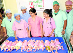 Hospital staff with 11 babies born on 11/11/11 in Surat on Friday