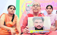 Sarbjits family members sitting on a dharna at the Jantar Mantar