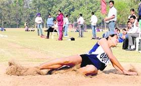 An athlete in action during triple jump event at Atheletic meet held at Punjab University in Chandigarh on Saturday