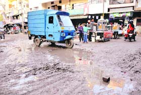 Sewage has spilled onto the road as the sewerage system overflows at Burail