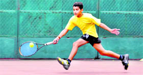 A player in action in a match in the 13th Uttarakhand State Open Junior Tennis Tournament in Dehradun on Saturday.