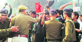 Policemen jostle with workers of the ABVP at Roorkee on Saturday.