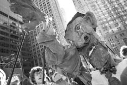 A giant effigy of Barack Obama is held up by people affiliated with the Occupy Wall Street movement during a march in New York