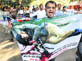 Supporters of the Armed Forces Special Powers Act and Army Rights hold a protest in support of the Army in New Delhi on Saturday.
