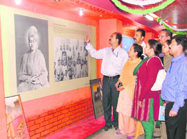 People view an exhibition, which gives a glimpse to Swami Vivekanandas life and teachings onboard the Vivek Express at the Ludhiana Railway Station. 