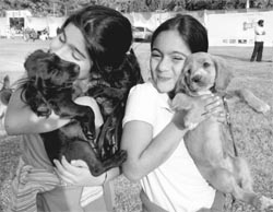 Girls with their pets during the dog show in Panchkula on Sunday